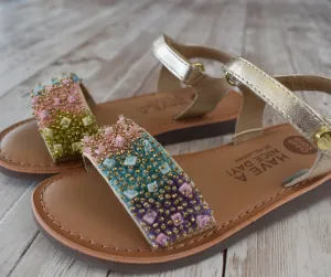 Golden leather sandals with multicolr beads.Gioseppo